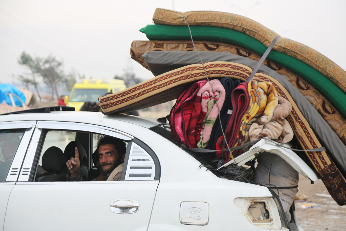 A convoy, evacuating civilians and opposition group members who left east Aleppo that had been under siege by Assad regime and its supporter foreign terrorists, arrive in opposition controlled Rashideen Town of Aleppo, Syria on December 22, 2016 . ( Ahmed
