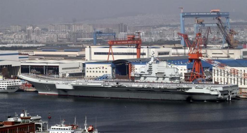 A general view shows navy soldiers standing on China's first aircraft carrier 'Liaoning' as it is berthed in a port in Dalian, northeast China's Liaoning province, September 25, 2012. REUTERS/Stringer