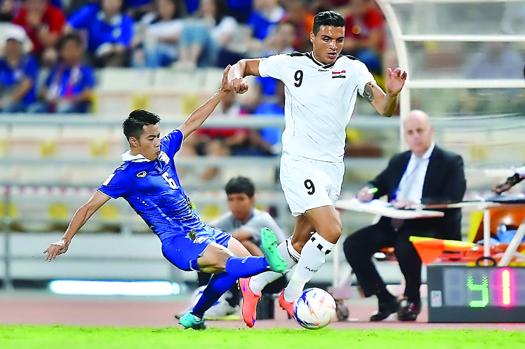 Iraqi player Ahmed Yaseen (wearing white) in action in this file photo