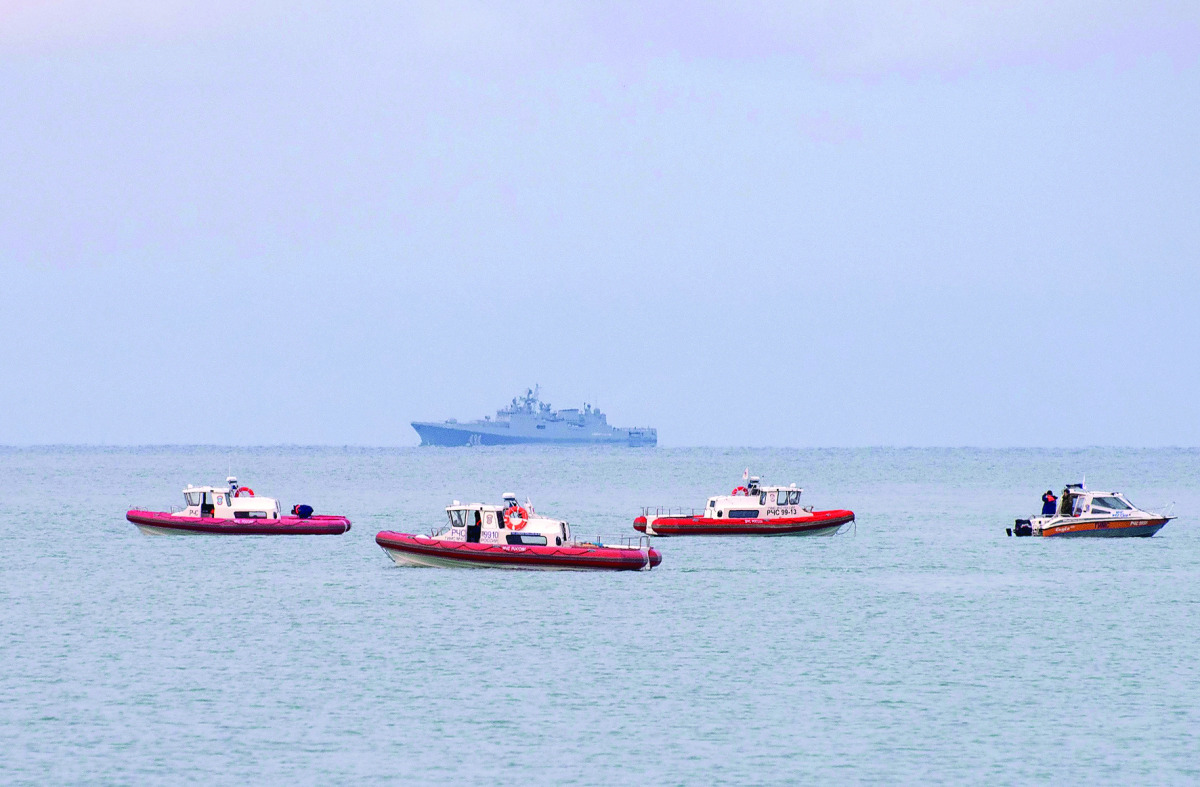 Russian rescue boats patrol off the coast of the Black Sea City of Sochi in search of debris of a Russian military plane, yesterday.