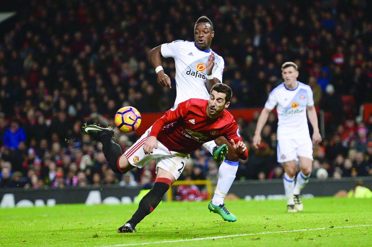 Manchester United's Henrikh Mkhitaryan strikes the ball with the back of his heel to score a goal against Sunderland during their Premier League match at Old Trafford in Manchester, England, on Monday.