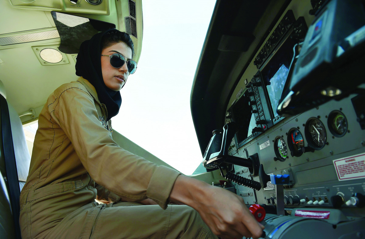 This 2015 file photograph shows Afghanistan's first female pilot Niloofar Rahmani sitting in a fixed-wing Afghan Air Force aviator aircraft at an airfield in Kabul.