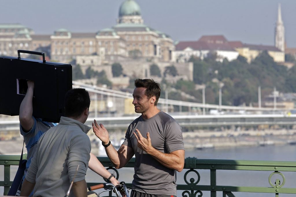 File photo of Australian actor Hugh Jackman chatting with crew members on the 'Szabadsag' bridge in Budapest during a commercial film shooting. AFP / FERENC ISZA
