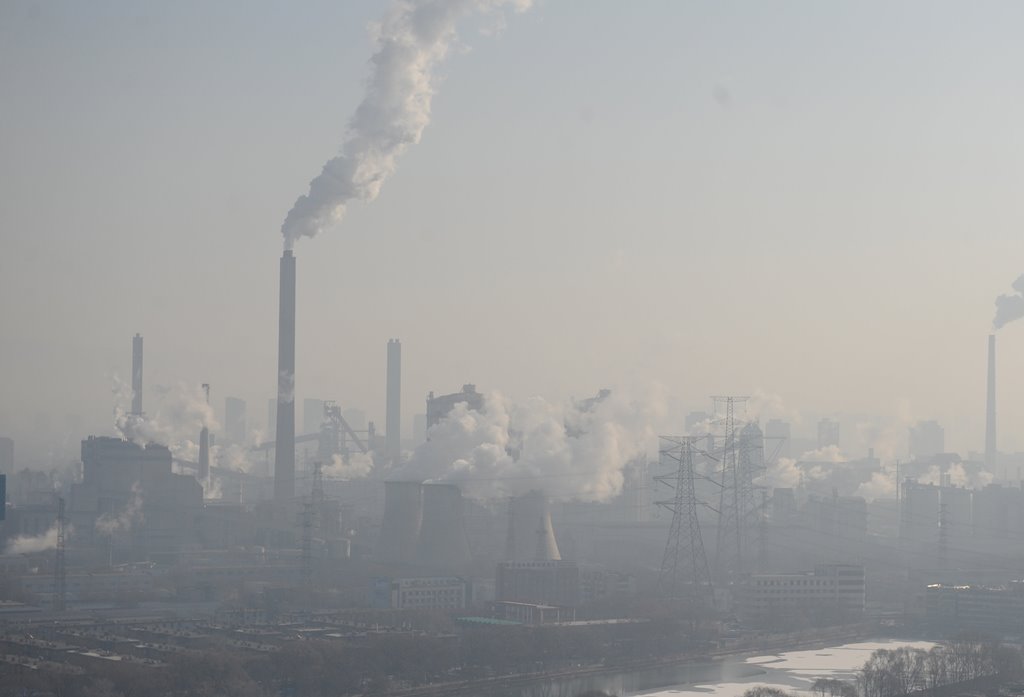 Smog billows from chimneys and cooling towers of a steel plant during hazy weather in Taiyuan, Shanxi province, China, December 28, 2016. REUTERS/Stringer