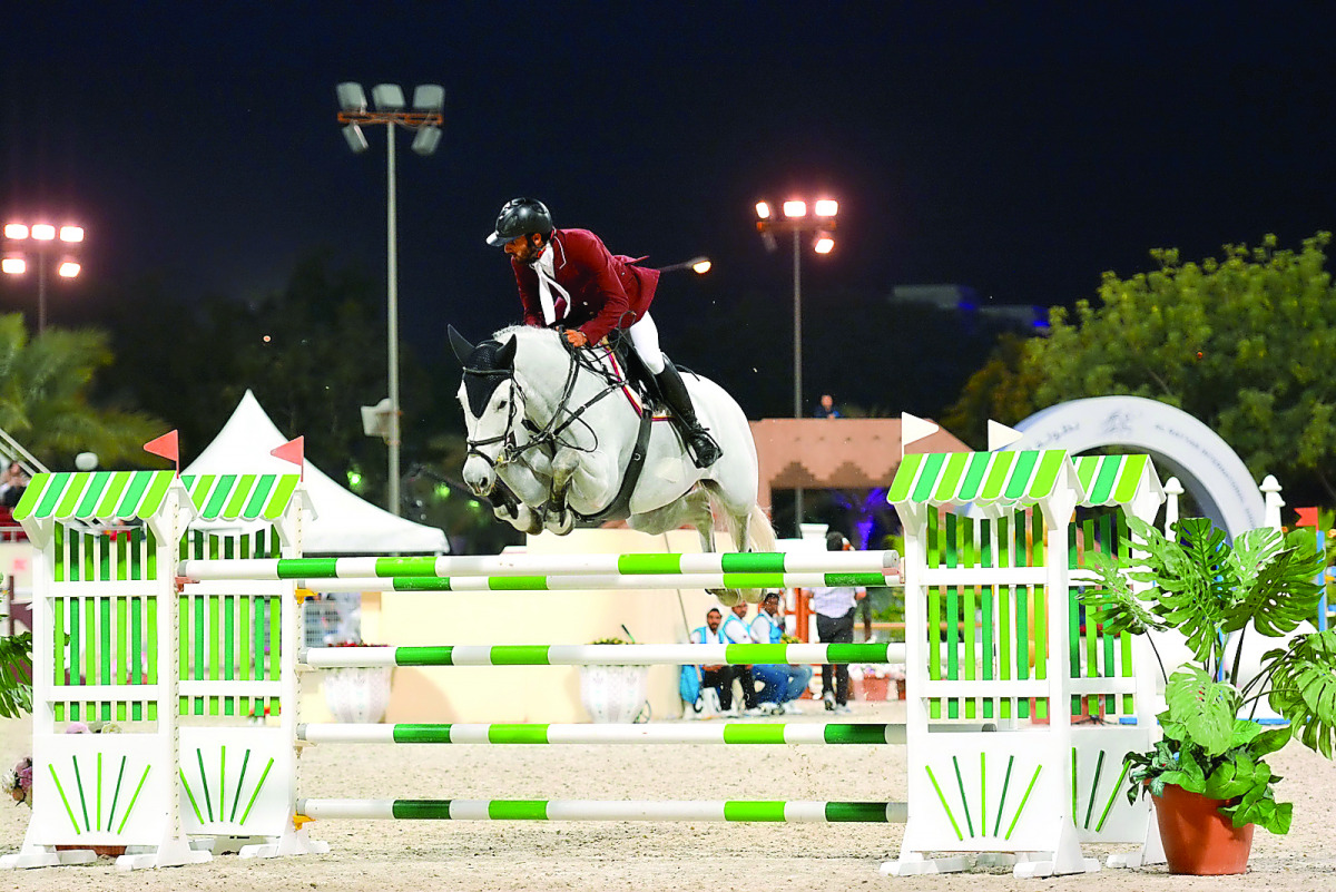 Rashid Towaim Al Marri. astride Beyonce, clears a hurdle during the second day of the Al Rayyan International Show Jumping Championship at the Qatar Equestrian Federation's (QEF) Main Arena yesterday. Pictures by Lotfi Garsi