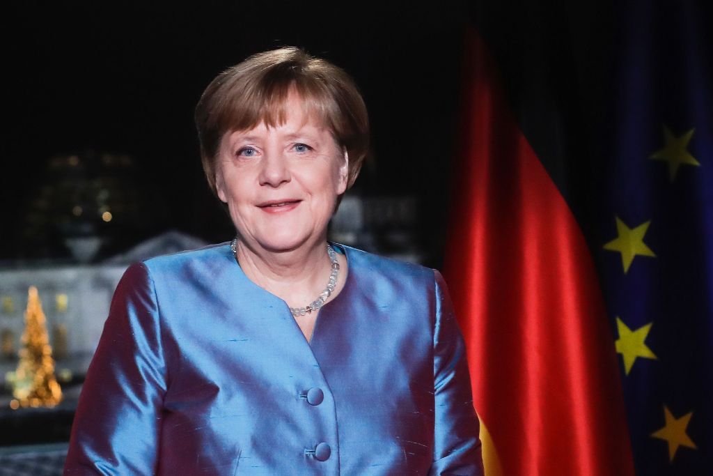 German Chancellor Angela Merkel poses for a photograph after the recording of her annual New Year's speech at the Chancellery in Berlin on December 30, 2016. / AFP / POOL / Markus Schreiber
