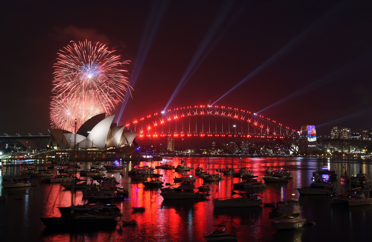 A family fireworks illuminates the sky above the iconic Opera House in Sydney on December 31, 2016, ahead of New Years fireworks. AFP / SAEED KHAN