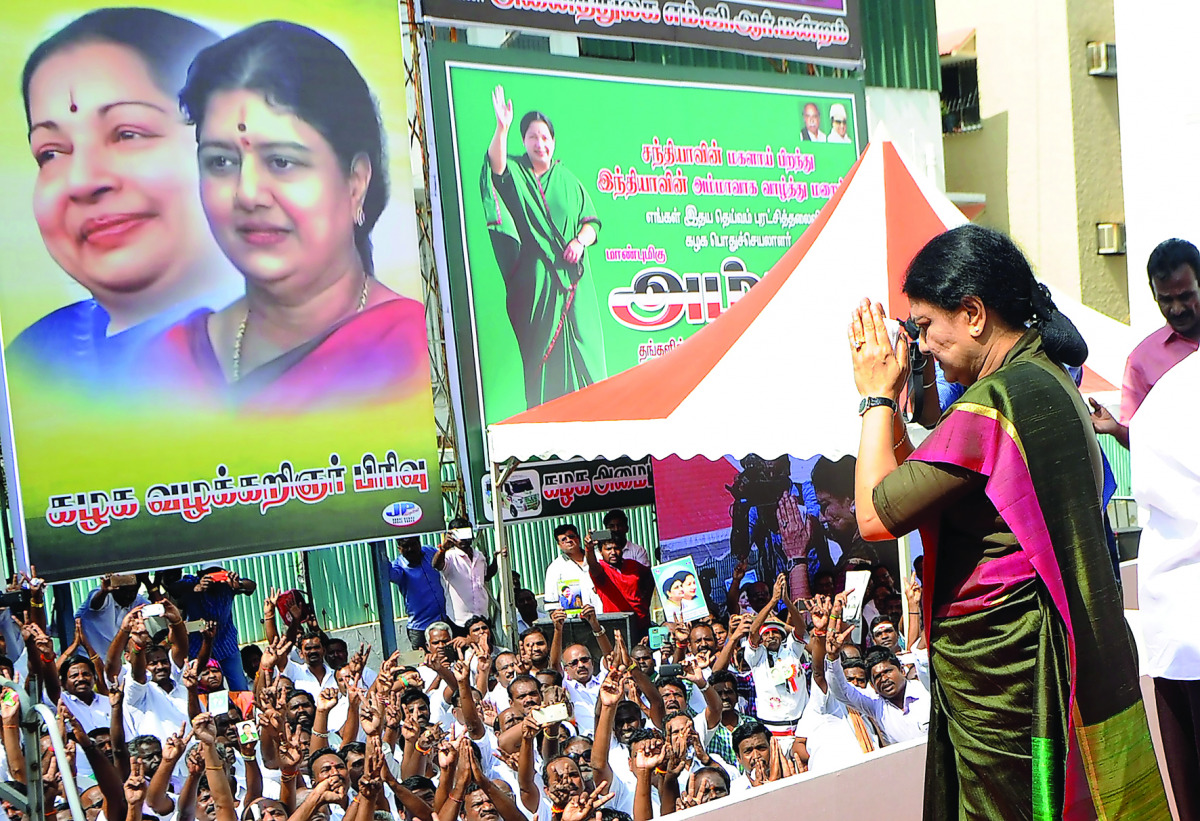 General secretary of southern Tamil Nadu state's ruling All India Anna Dravida Munnetra Kazhagam (AIADMK), VK Sasikala gestures to cadres on her arrival to take up office at the AIADMK headquarters in Chennai on December 31, 2016.
VK Sasikala was elected