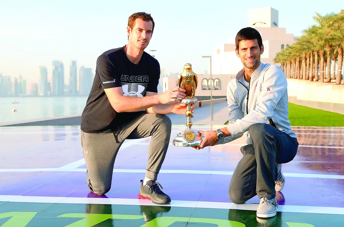 World’s top two ranked players, Andy Murray and Novak Djokovic, pose for a photograph with the Qatar ExxonMobil Open trophy, in front of the iconic Museum of Islamic Art  in Doha. The ATP event is organised by Qatar Tennis Federation.