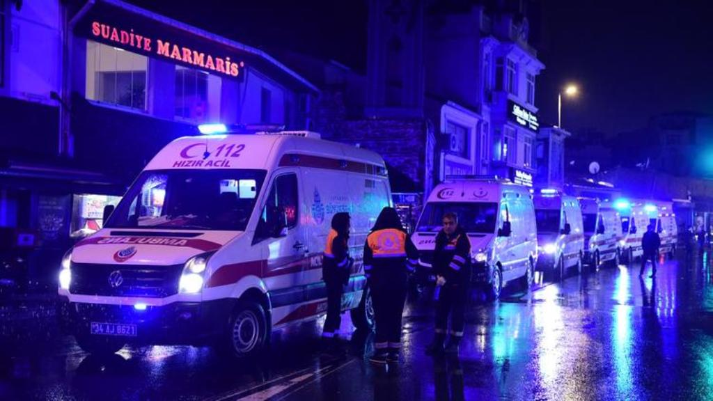 Ambulances are seen at the site of an armed attack on Jan. 1, 2017, in Istanbul. (YASIN AKGUL / AFP/Getty Images).