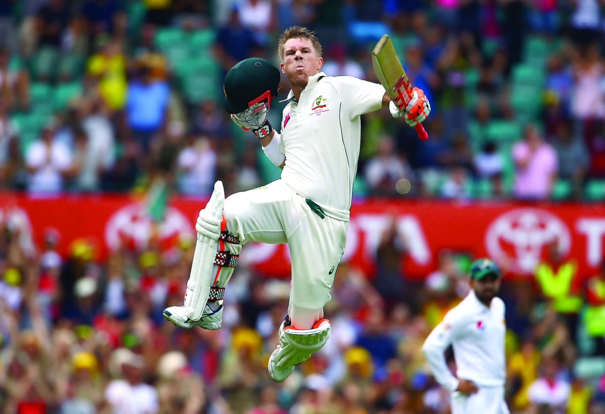Australia's David Warner celebrates after reaching his century during the first session of the third Test against Pakistan at the Sydney Cricket Ground in Sydney, Australia yesterday.