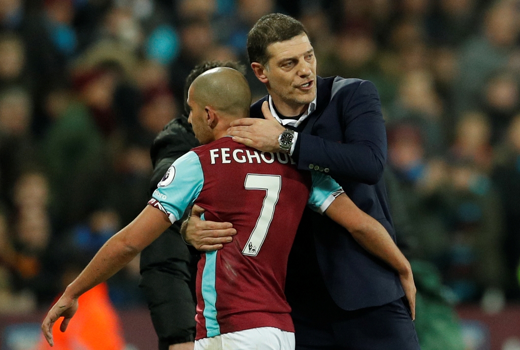 West Ham United's Sofiane Feghouli hugs West Ham United manager Slaven Bilic after being sent off. Reuters / John Sibley