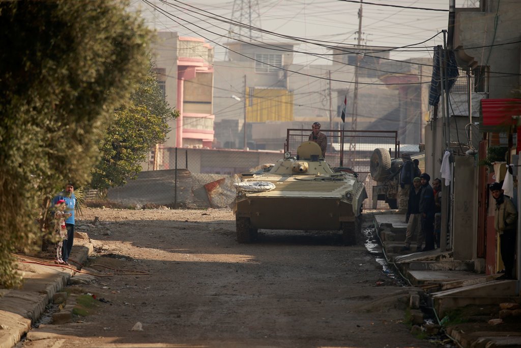An Iraqi rapid response forces military vehicle is seen in a street during battle with Islamic State militants in the Mithaq district of eastern Mosul, Iraq, January 4, 2017. REUTERS/Thaier Al-Sudani
