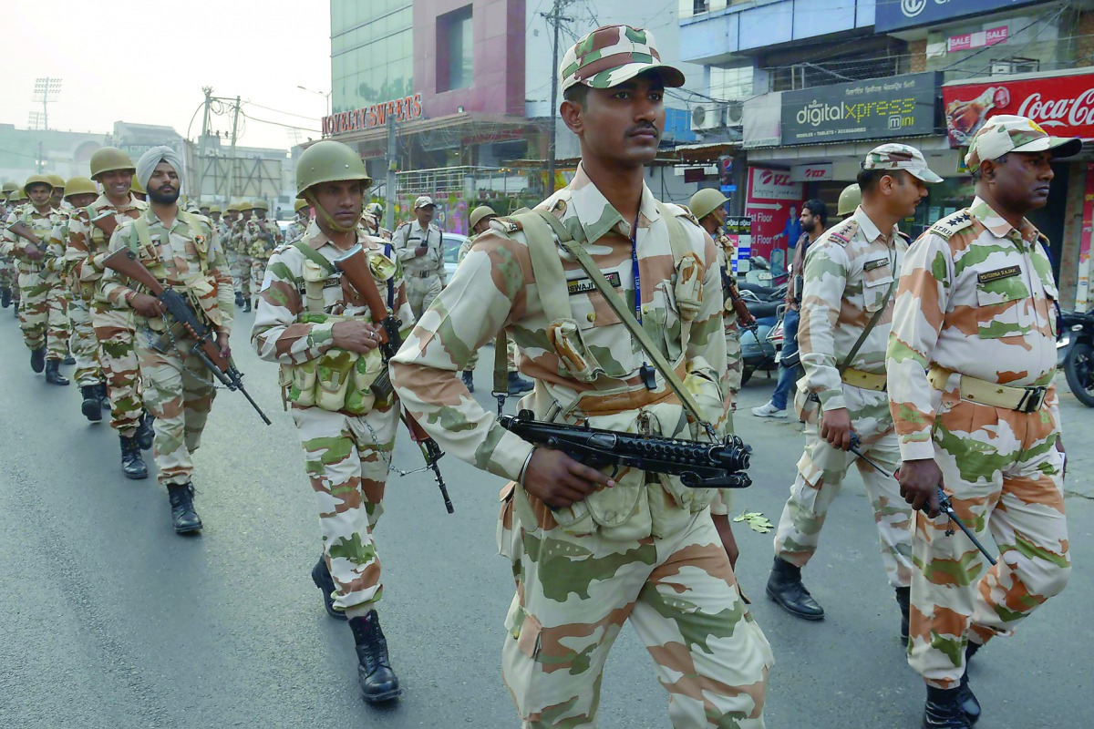 Paramilitary forces patrol along a road in Amritsar yesterday as part of election security.