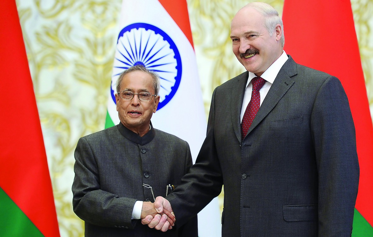 Belarus President Alexander Lukashenko shakes hands with his Indian counterpart Pranab Mukherjee at the Presidential Palace in Minsk yesterday.