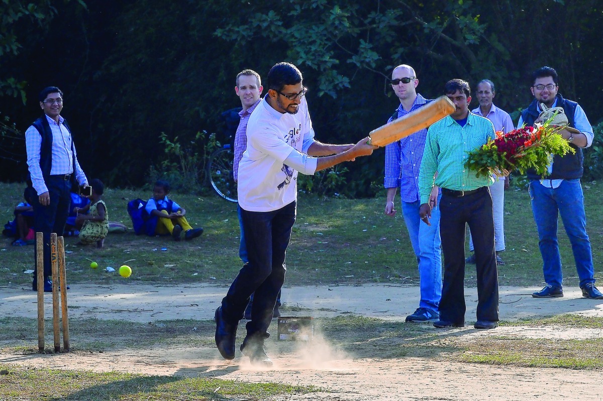 Google Inc CEO Sundar Pichai plays cricket with villagers on the occassion of his visit to IIT Kharagpur, some 120km west of Kolkata, yesterday.