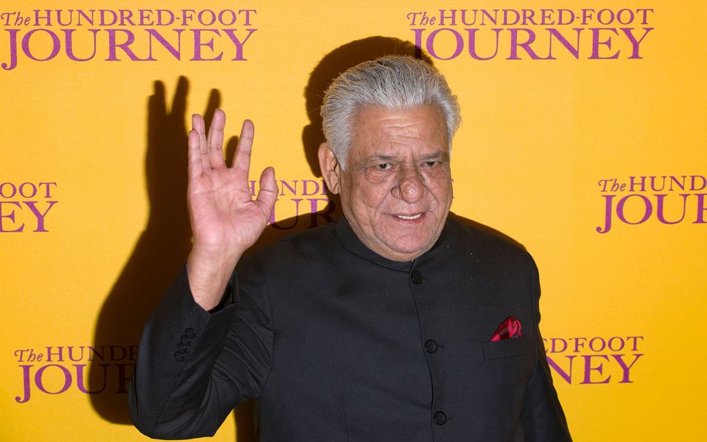 (FILES) This file photograph taken on September 3, 2014, shows Indian Bollywood actor Om Puri waving as he attends the UK Gala Screening of the film, The Hundred Foot Journey, in central London. AFP / JUSTIN TALLIS
