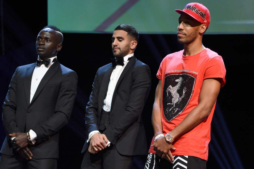African best players from left, Senegalese Sadio Mane, Algerian Riyad Mahrez, and Gabonese Pierre-Emerick Aubameyang stands for the announcement of African Footballer of the Year in Abuja, on January 5, 2017.  AFP / PIUS UTOMI EKPEI
