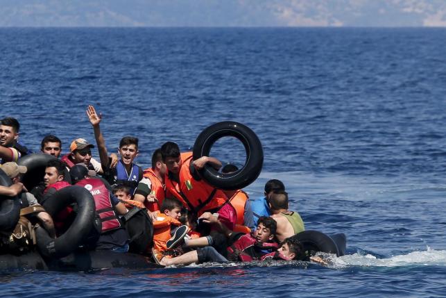 Drowning migrants being rescued on their way to Greece (Reuters) 