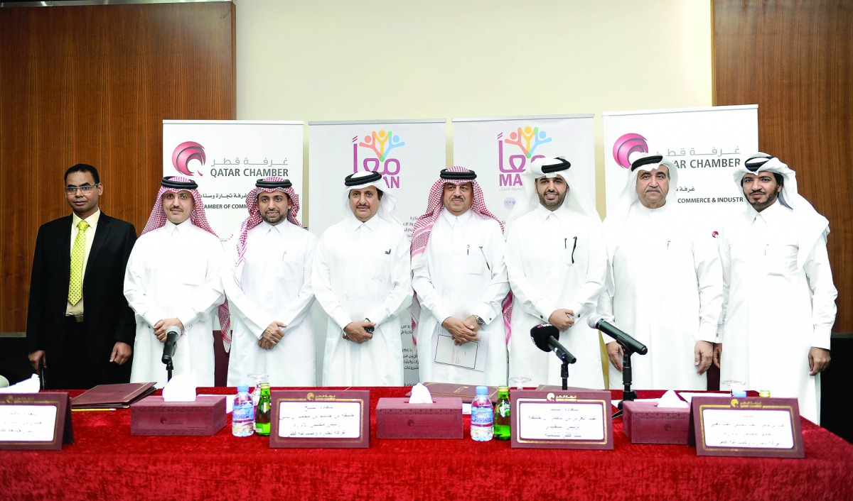 Sheikh Khalifa bin Jassim Al Thani (fourth left), Chairman, QC; with Dr Hassan Rashid Al Derham (third left), President, QU; Abdulaziz bin Nasser Al Khalifa (third right), CEO, QDB; and other officials at the signing ceremony held at Qatar Chamber yesterd