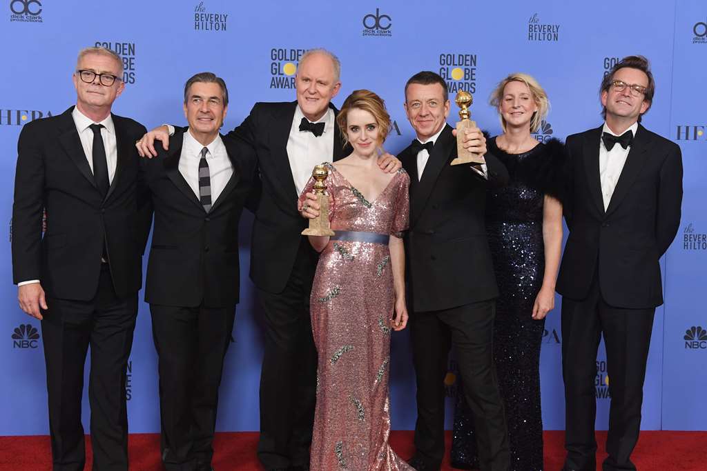 (L-R) Cast and crew of 'The Crown,' winner of Best Series - Drama, pose in the press room during the 74th Annual Golden Globe Awards at The Beverly Hilton Hotel on January 8, 2017 in Beverly Hills, California. Kevin Winter/Getty Images/AFP