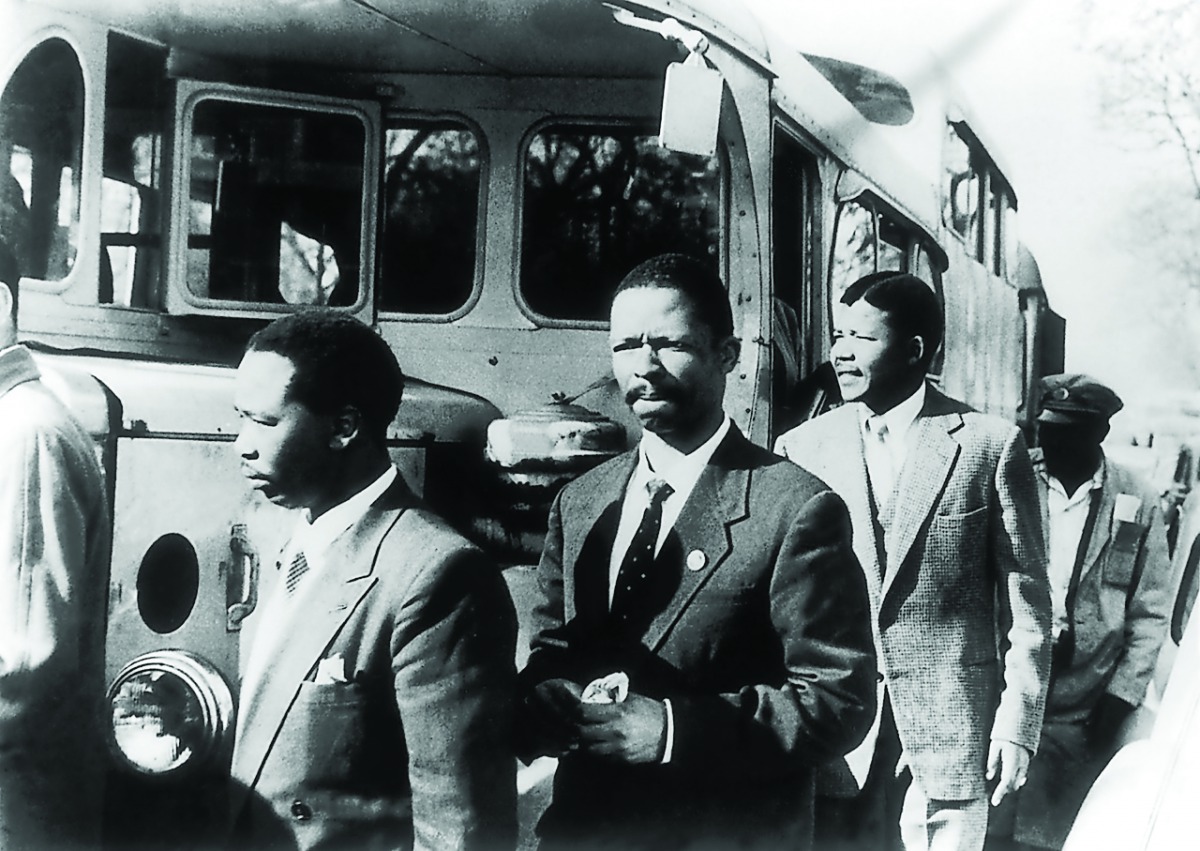 A file photo of Nelson Mandela (third right), leader of the African National Congress (ANC), Patrick Molaoa and Robert Resha charged with treason by the South-African Union in Johannesburg, South Africa.
