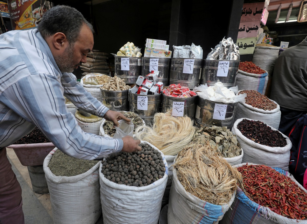 A herbal store worker takes ingredients to prepare a natural herbal drug in Cairo, Egypt January 10, 2017. Picture taken January 10, 2017. REUTERS/Mohamed Abd El Ghany