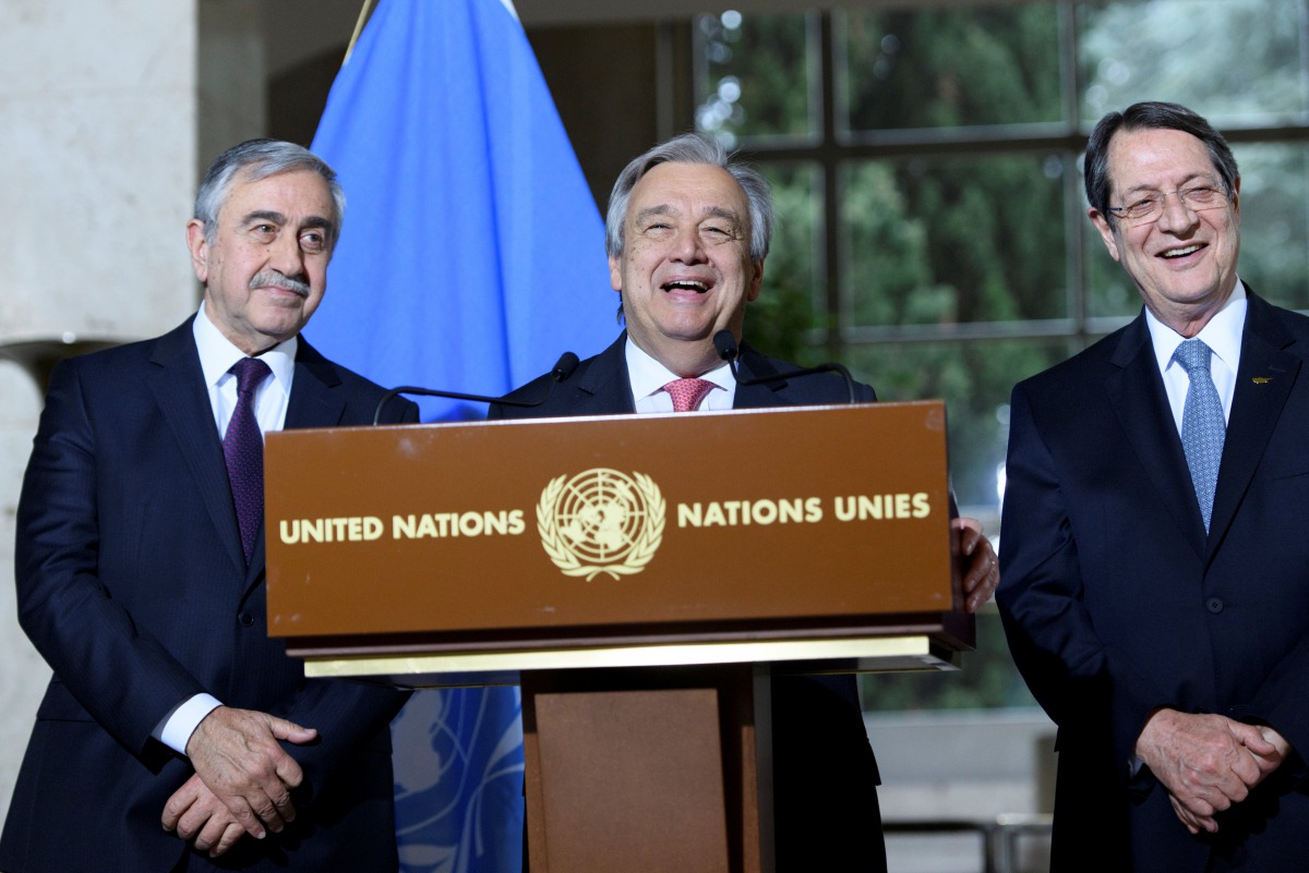 UN Secretary-General Antonio Guterres (C) speaks next to Greek Cypriot President Nicos Anastasiades (R) and Turkish Cypriot leader Mustafa Akinci during a press conference after the Conference on Cyprus, on the sidelines of the Cyprus Peace Talks, at the 
