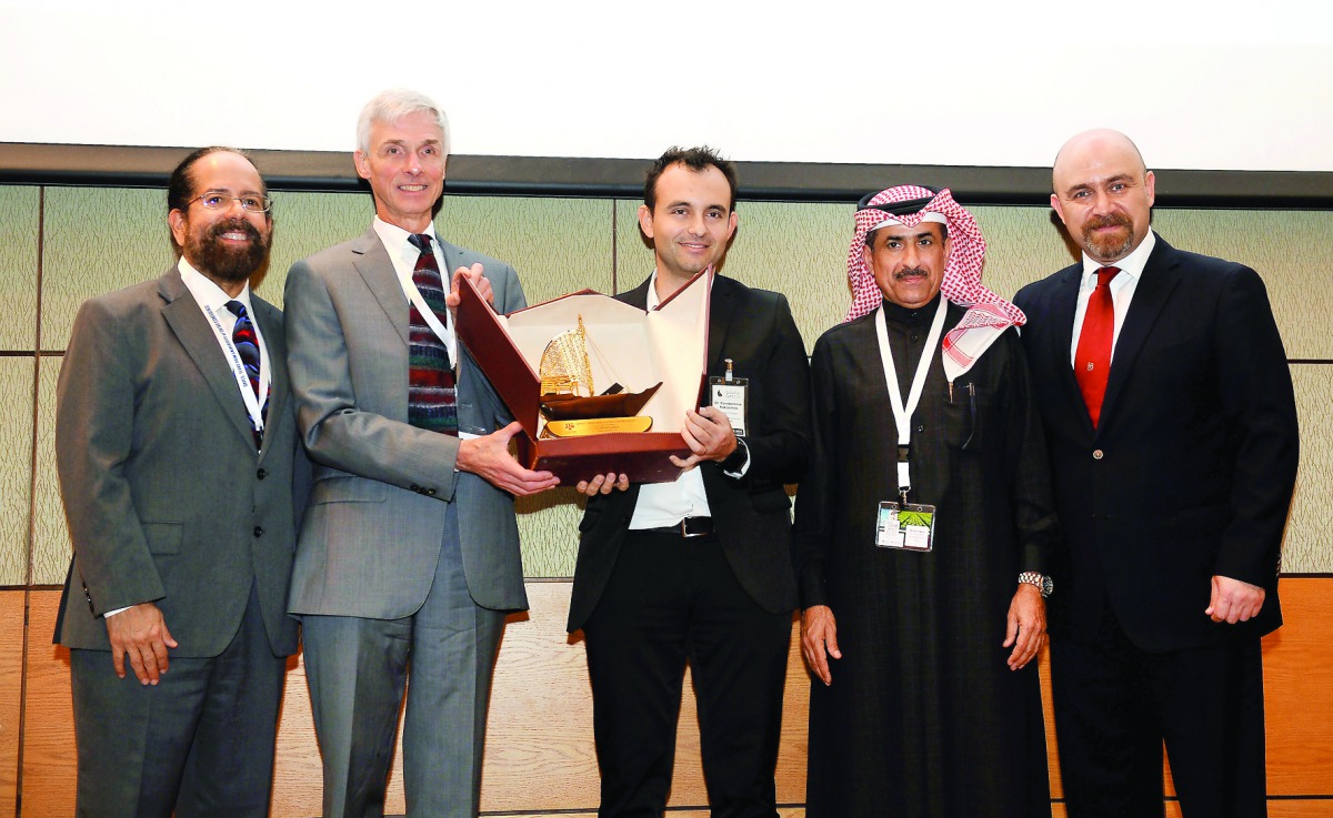 Dr Konstantinos E Kakosimos (third left), Assistant Professor, TEXAS A & M University, Qatar (TAMUQ), presenting a memento to Dr Michael Ladisch of Purdue University, USA; during the opening of the QAFCO -TAMUQ Conference on Water, Energy and Food Nexus, 