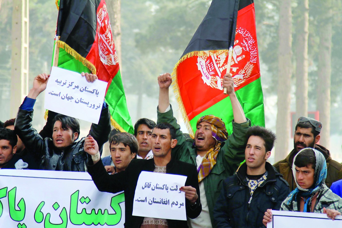 Afghan people shouts slogans and hold banners during a protest against Pakistan in front of the Pakistani Embassy in Herat, Afghanistan on January 14, 2017. Protesters accuse Pakistan government for the recent attacks in Afghanistan. (Mir Ahmad Firooz - A