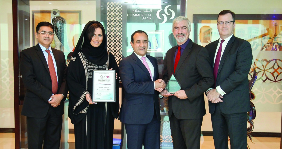 Joseph Abraham, Commercial Bank CEO (third left) and other top officials with the award.