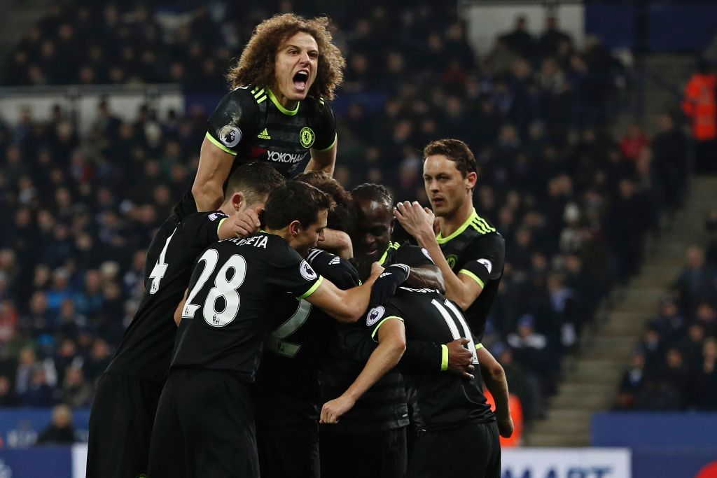 Chelsea's Spanish midfielder Pedro (R) celebrates with teammates after scoring their third goal during the English Premier League football match between Leicester City and Chelsea at King Power Stadium in Leicester, central England on January 14, 2017.  A
