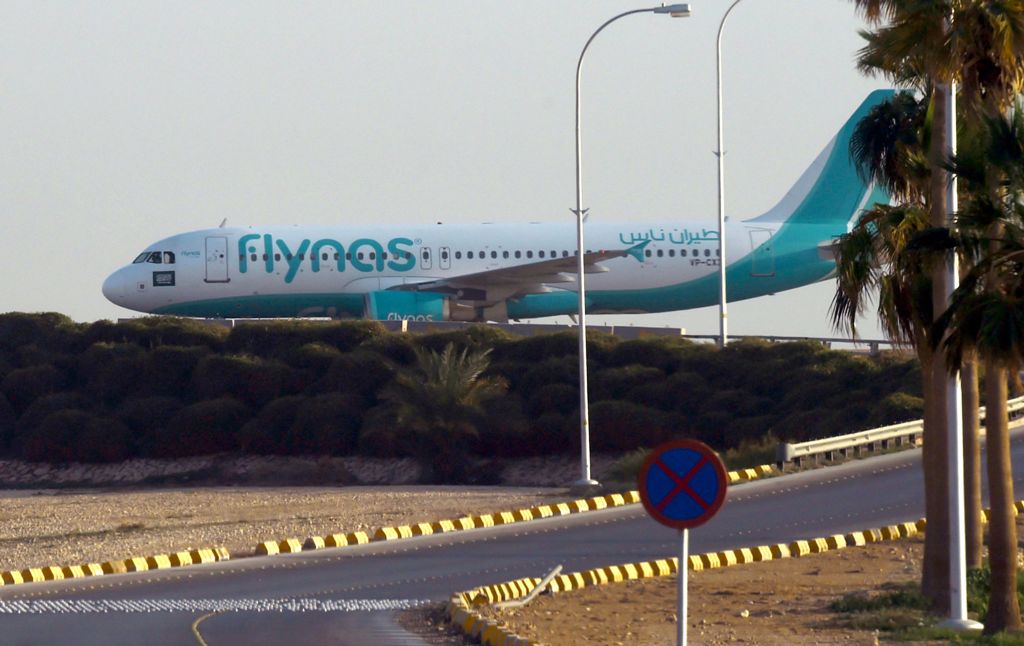 (FILES) This file photo taken on January 12, 2017 shows a plane from the low-cost Saudi carrier flynas as it taxies on the tarmac at the King Khalid International Airport in Riyadh on January 12, 2017. AFP / FAYEZ NURELDINE
