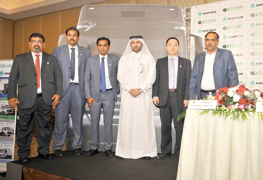 Saqr Saeed Al Mohannadi (fourth left) Zhang Houqin (second right), Mohammed Ali (right) and other officials during the press conference to announce the launching of Sinotruk from Seashore Automobiles at St.Regis Hotel yesterday. Pic Baher Amin/The Peninsu