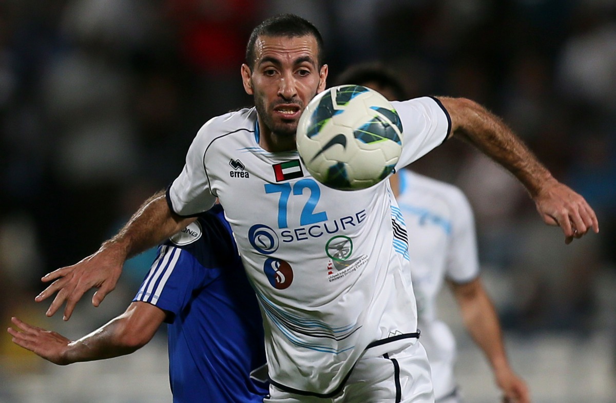  This file photo taken on May 17, 2013 shows Baniyas' Egyptian striker Mohamed Aboutrika controling the ball during their GCC Champions League first leg final football match against Al-Khor in Doha. Egyptian court has added former football star Mohamed Ab
