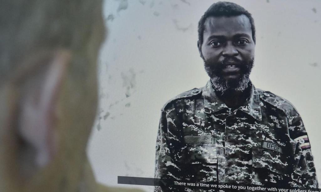 A man in Nairobi, Kenya, watches a video released by Somali militant group al-Shabab showing a Ugandan soldier moments before he was executed, on January 18. Al-Shabab said it captured the soldier in September 2015 during an attack on an African Union bas