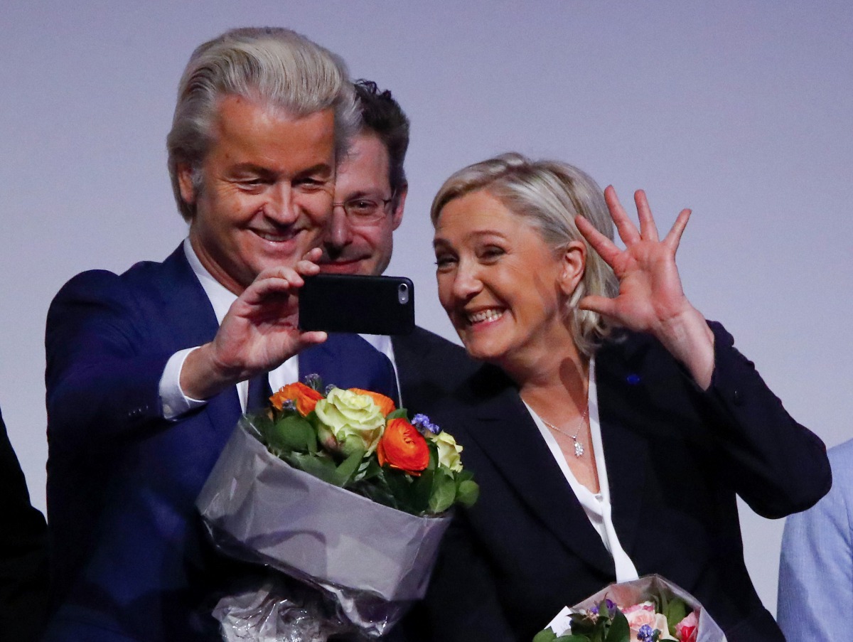 France's National Front leader Marine Le Pen and Netherlands' Party for Freedom (PVV) leader Geert Wilders take a Selfie during a European far-right leaders meeting to discuss about the European Union, in Koblenz, Germany, January 21, 2017. (REUTERS/Wolfg