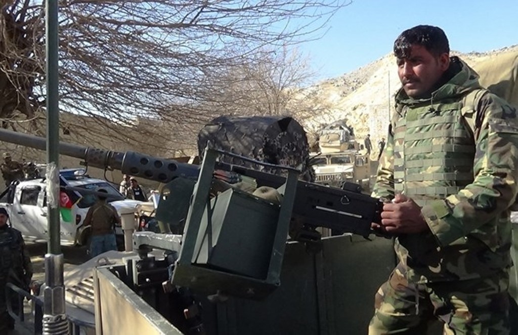 A member of the Afghan security forces keeps watch following clashes with ISIS fighters in Kot District in eastern Nangarhar province on February 6, 2016. AFP PHOTO.
