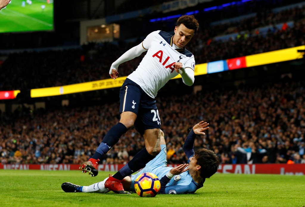 Tottenham's Dele Alli in action with Manchester City's David Silva. Reuters / Jason Cairnduff