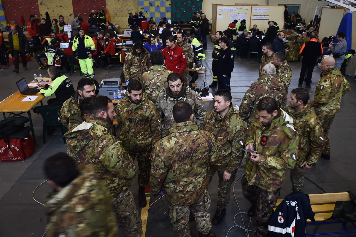 Italian soldiers gather at the rescue operations center in Penne, some 20 km from the site of an avalanche that engulfed the Hotel Rigopiano in heavy snow and earthquake-ravaged central Italy, on January 23, 2017. Italian rescuers pulled nine survivors fr