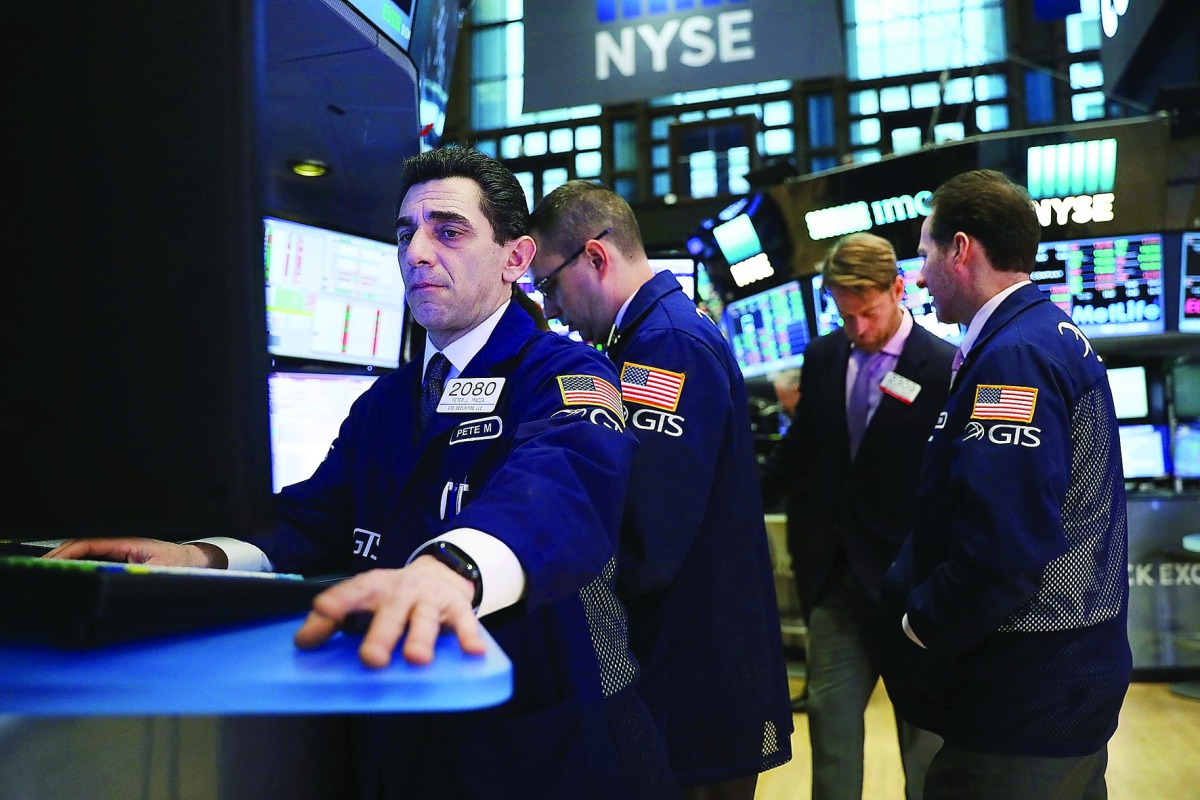 Traders work on the floor of the New York Stock Exchange (NYSE) in New York City, in the US.