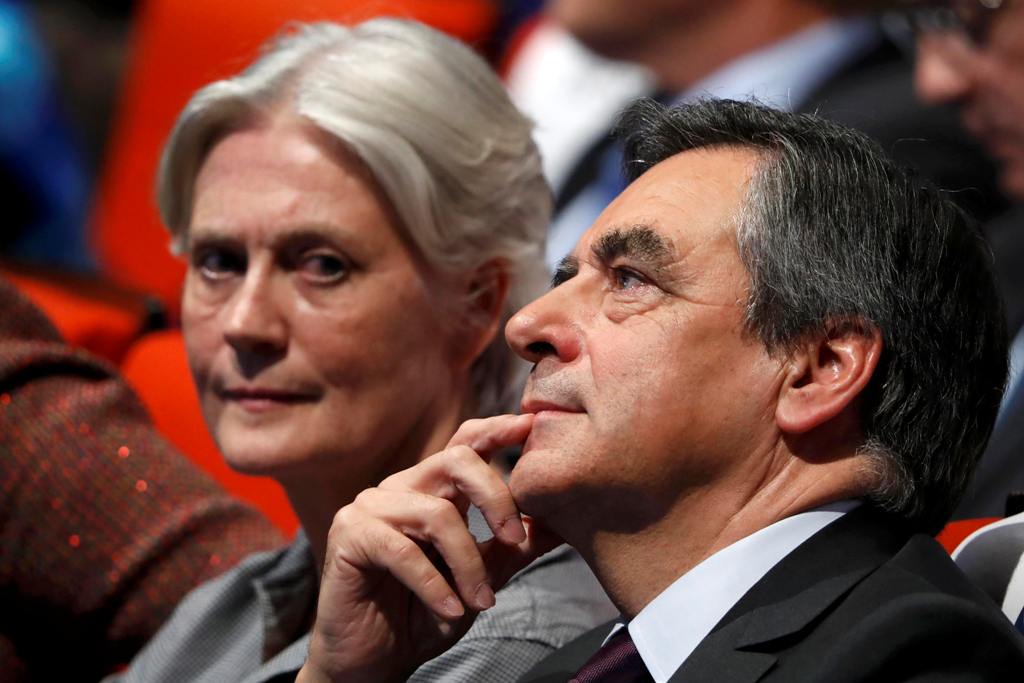 FILE PHOTO - French politician Francois Fillon, member of the conservative Les Republicains political party and his wife Penelope (L) attend a final rally ahead of the first round of vote to choose the conservative candidate for France's presidential elec