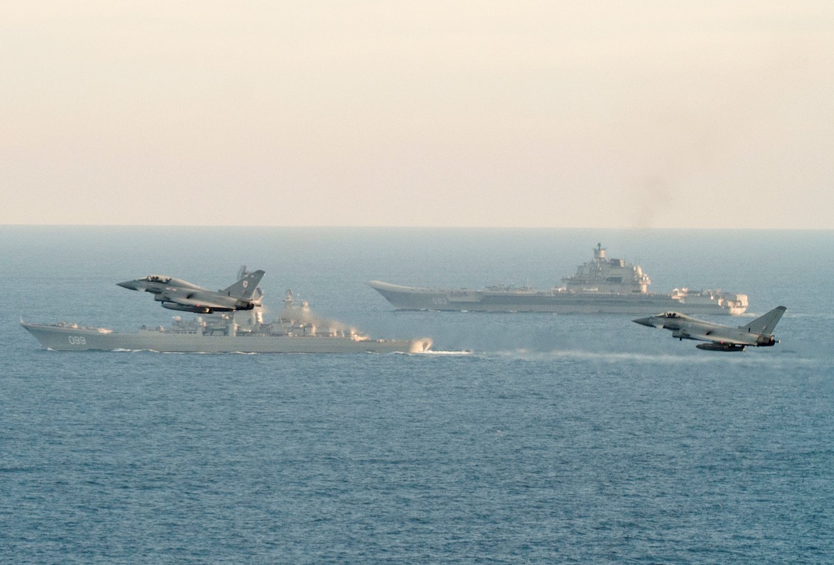 RAF Typhoons monitor Russian warships Pyotr Velikiy and the Admiral Kuznetsov (rear) as they pass close to UK territorial waters, in this photograph released in London on January 25, 2017. Ministry of Defence/Crown Copyright 2017/Handout via REUTER