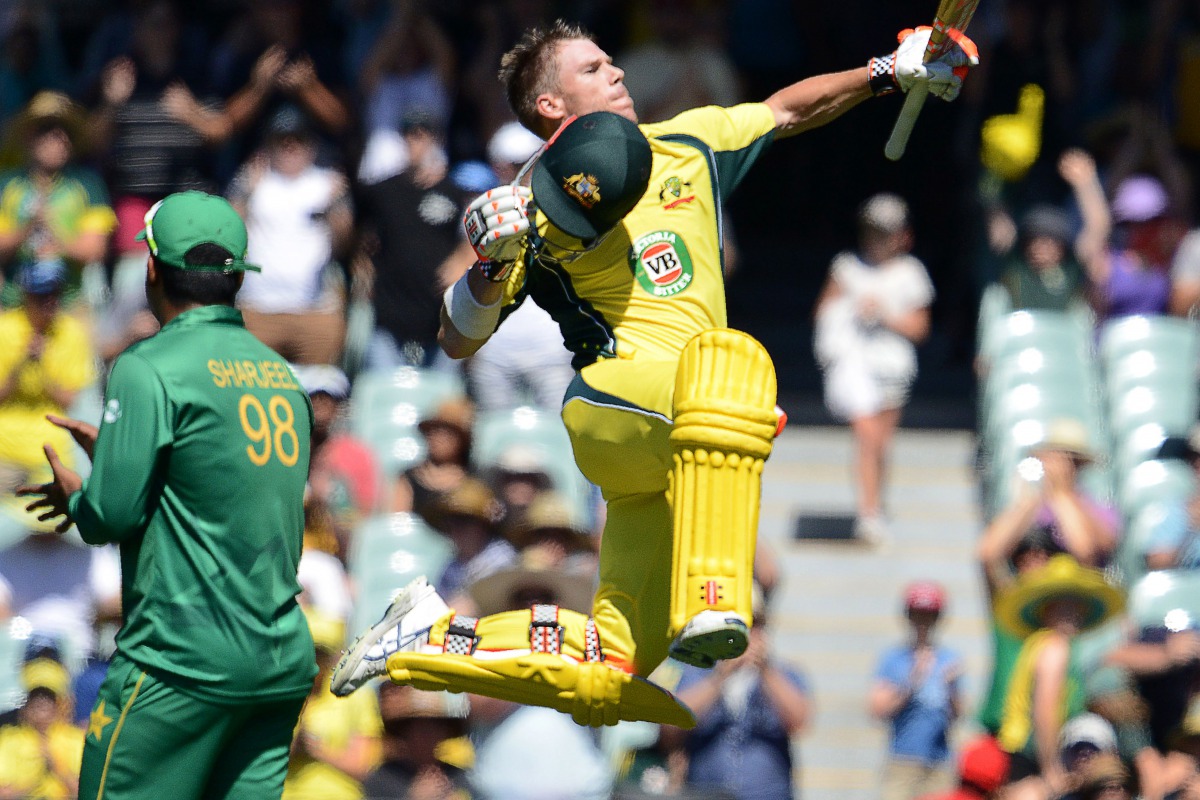 Australia's David Warner reacts after scoring 100 during the one-day international cricket match between Australia and Pakistan at the Adelaide Oval in Adelaide on January 26, 2017. (AFP / Brenton Edwards)