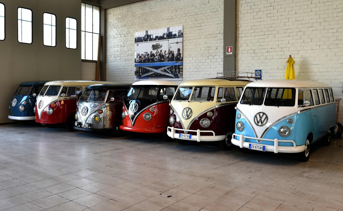 Vintage Volkswagen Kombi bus are parked in a garage after being completly restored by mechanics of the T1 specialist company on November 3 2016 in Florence AFP