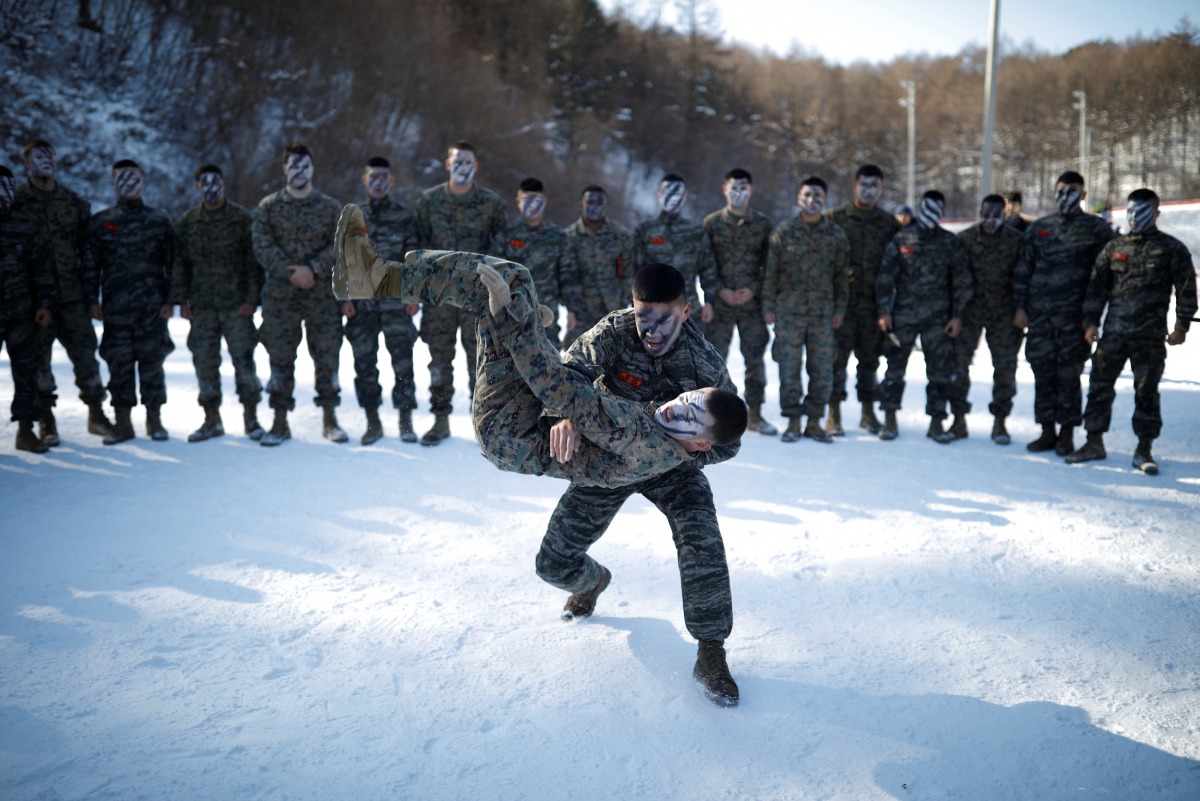 South Korean and U.S. Marines demonstrate their martial arts skills in a winter military drill in Pyeongchang, South Korea, January 24, 2017. REUTERS/Kim Hong-Ji