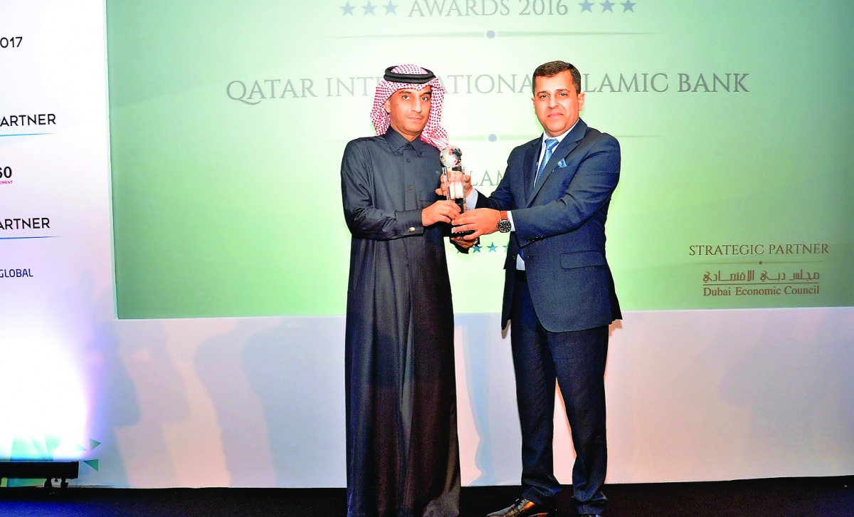 Jamal Al Jamal, deputy CEO of QIIB, receiving the award at a ceremony held in Dubai.