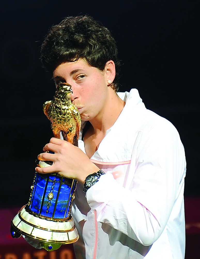 Carla Suarez Navarro of Spain celebrates her victory in the 2016 edition of the Qatar Total Open in Doha.