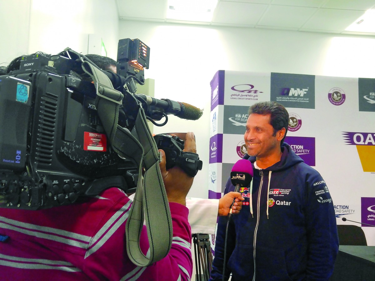 Nasser Saleh Al Attiyah, Qatar's premier rally driver, talks to a TV crew during an interview at Losail International Circuit yesterday. 