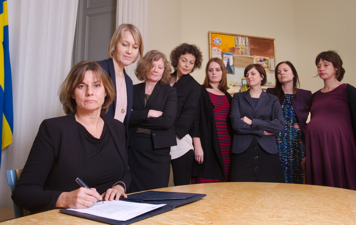 Swedish Environment Minister and Deputy Prime Minister Isabella Lovin (L) signs a referral of Swedish climate law, binding all future governments to net zero emissions by 2045 at the ministry in Stockholm on February 1, 2017. The bill signing was witnesse